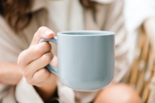 Woman with a coffee cup mockup - 1215319
