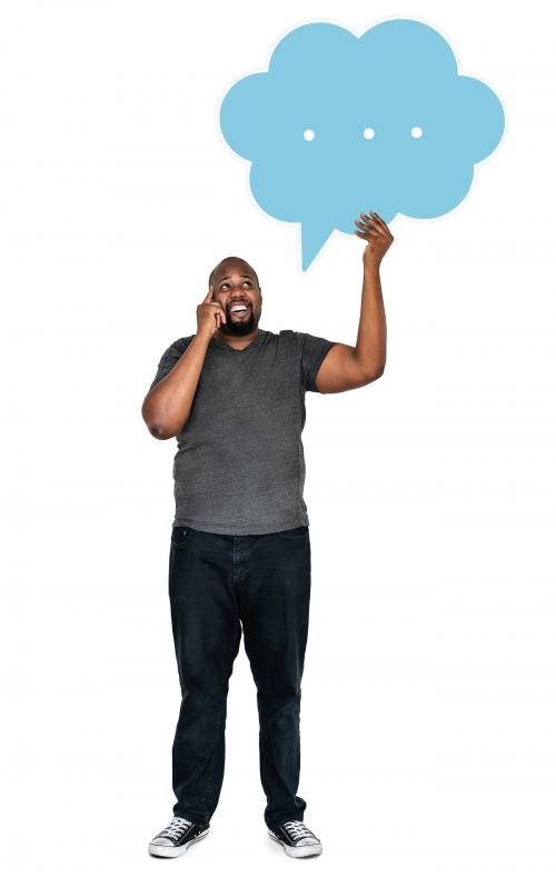 Man holding a speech bubble and talking on a phone - 477618