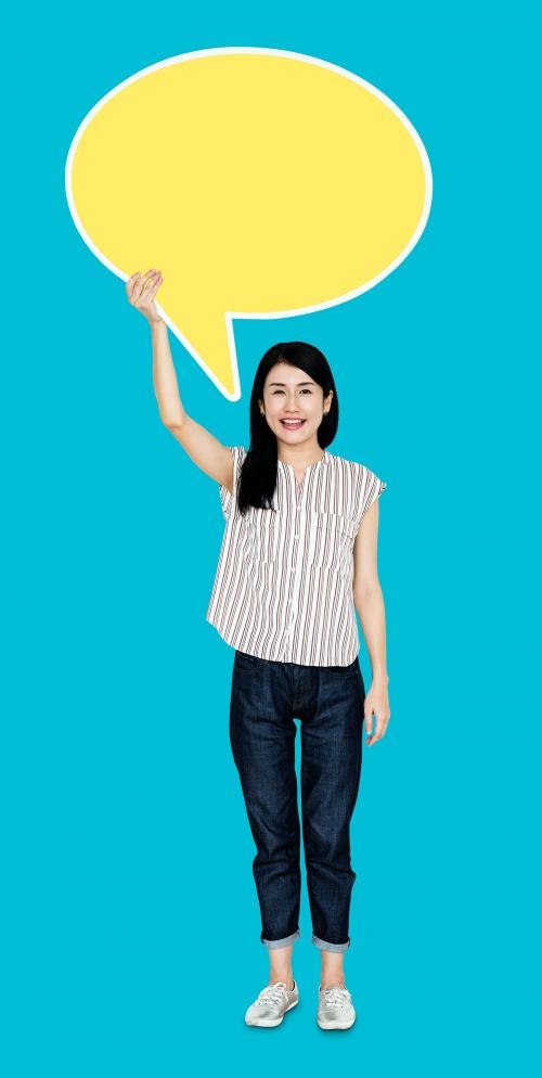 Woman holding a blank yellow speech bubble icon - 470200
