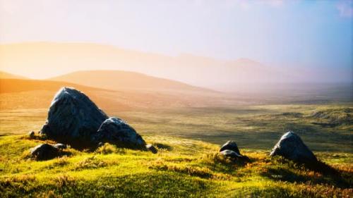 Videohive - Meadow with Huge Stones Among the Grass on the Hillside at Sunset - 32700098