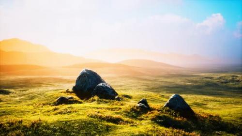 Videohive - Meadow with Huge Stones Among the Grass on the Hillside at Sunset - 32988798