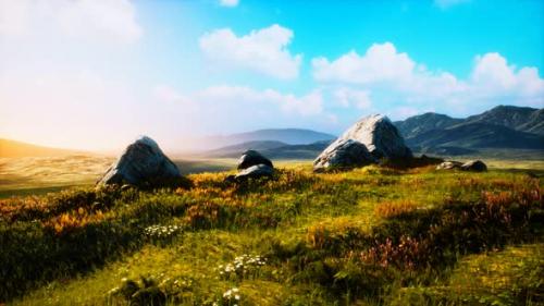Videohive - Meadow with Huge Stones Among the Grass on the Hillside at Sunset - 34249490