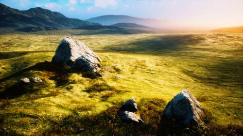 Videohive - Meadow with Huge Stones Among the Grass on the Hillside at Sunset - 34328679