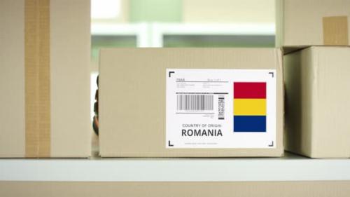 Videohive - Cardboard Parcel From Romania in a Postal Service Storage - 38398744