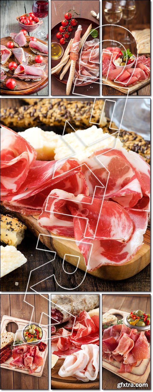Platter of serrano jamon Cured Meat, Ciabatta, chorizo and olive, Slices of italian ham on the wooden board - Stock photo