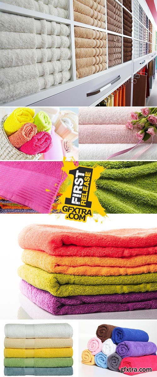 Stock Photo Colorful towels on wooden table on window background