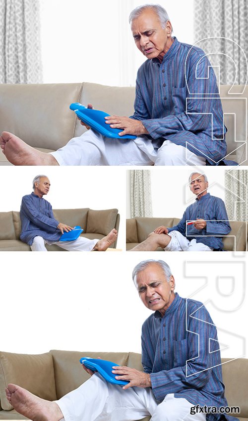 Stock Photos - Elderly man holding hot water bottle , applying ointment on knee