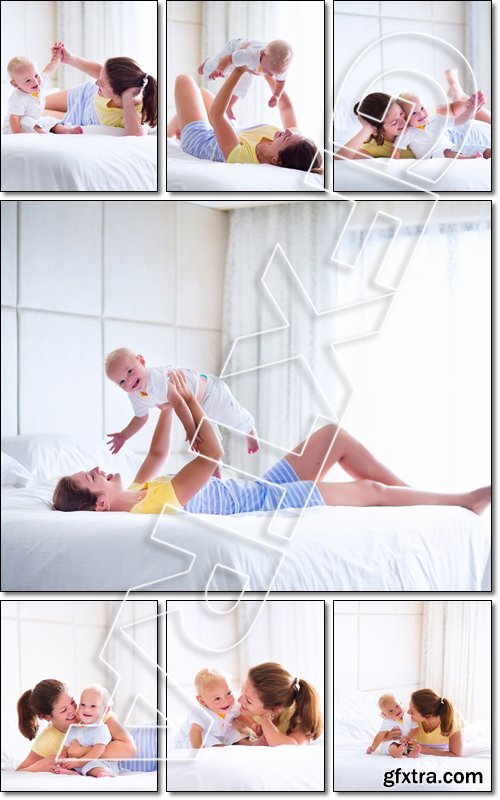 Mother and baby in bed. Young mom playing with her newborn son. Child and parent together at home. Family with kids in the morning - Stock photo