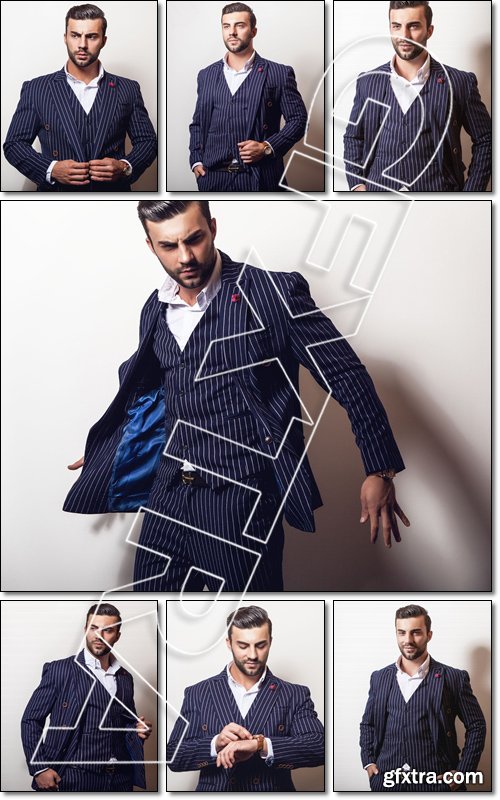 Elegant young handsome man in classic dark blue costume. Studio fashion portrait - Stock photo