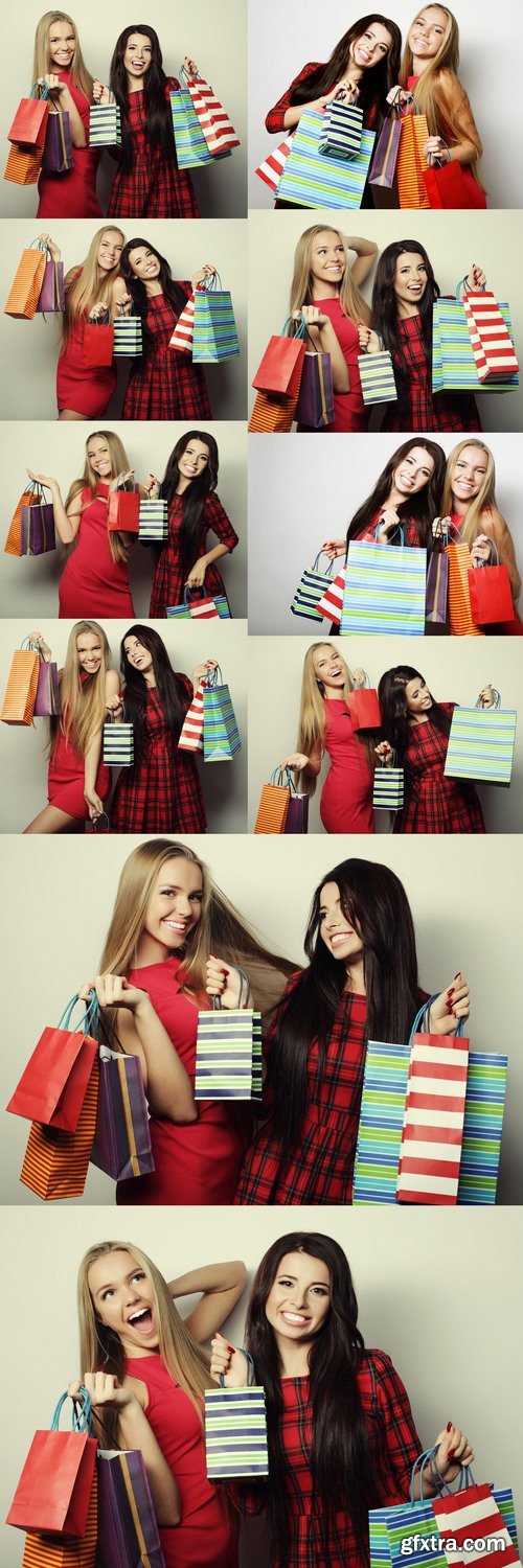 Two young women wearing red dress with shopping bags