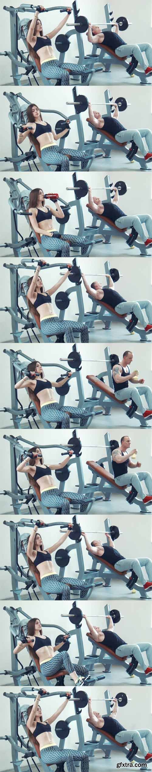 Brunette sportswoman and muscular man doing chest exercise