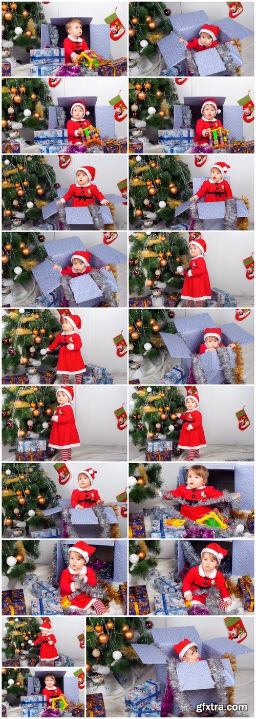 Cute little girl in Santa\'s suit near a Christmas tree - 19xUHQ JPEG Photo Stock