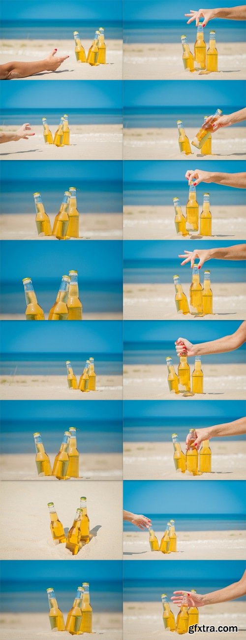 Ice cold beer bottles in the sand under the sun