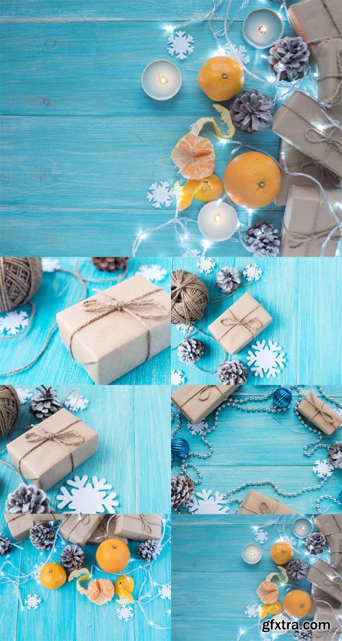 Photo Set - Kraft gift boxes, garland, candles, mandarins , snowflakes, Christmas decorations, cones on the wooden blue