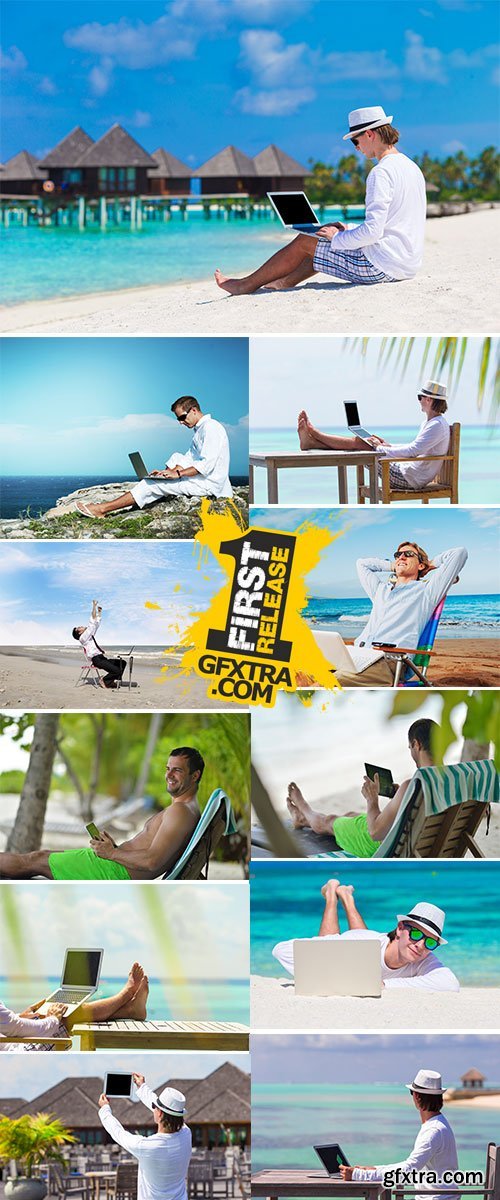 Stock Image Young man with tablet computer during tropical beach vacation
