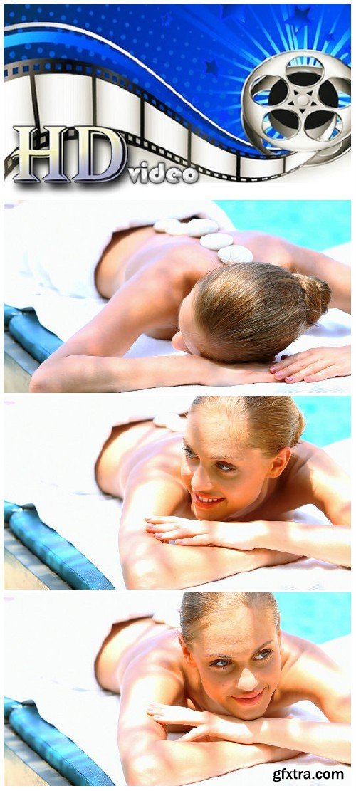 Video footage Woman taking hot stones massage in tropical outdoor