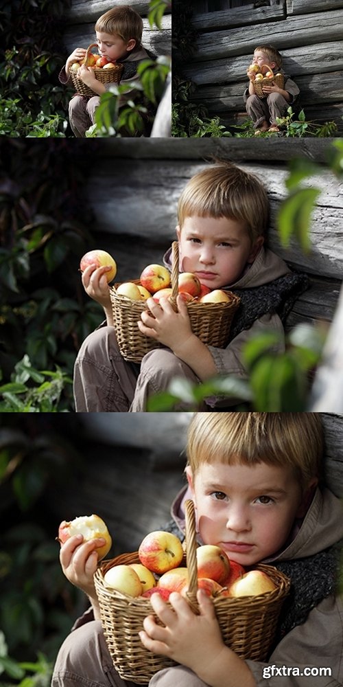 boy with a basket on his hands biting an apple on a background