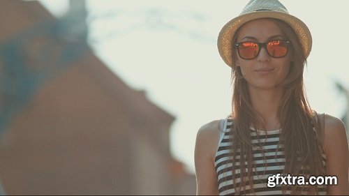 Beautiful young woman smiling in the european city cinematic portrait slow motion happy hipster