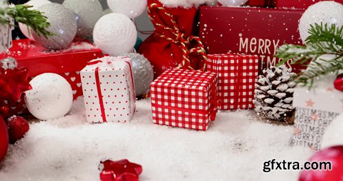 Background video with Christmas ornaments and gift box and snow