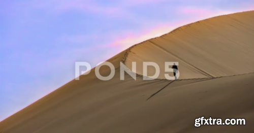 Pond5 - Climbing The Sand Dune 44521036
