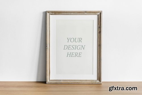 Photo frame on wooden table mockup