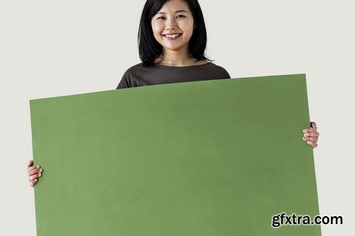 Happy Asian woman holding Mockup speech bubble