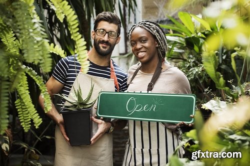 Couple holding an ?open? Mockup sign