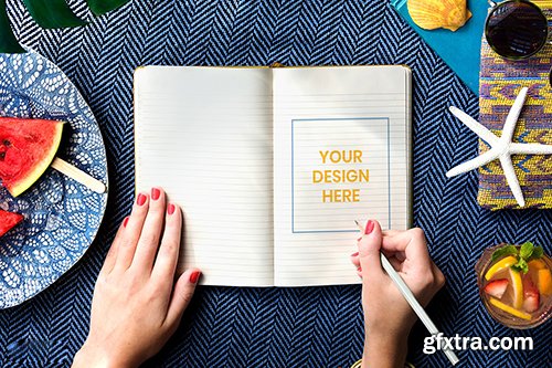 Woman writing in a notebook mockup 894882