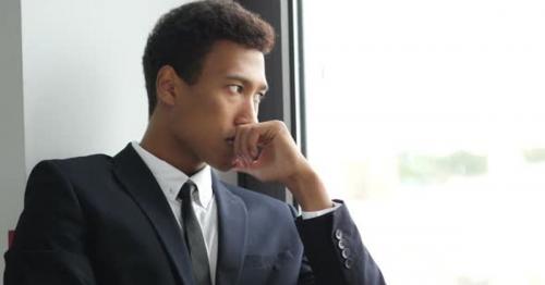 Thinking Pensive Black Businessman in Suit, Looking Through Window