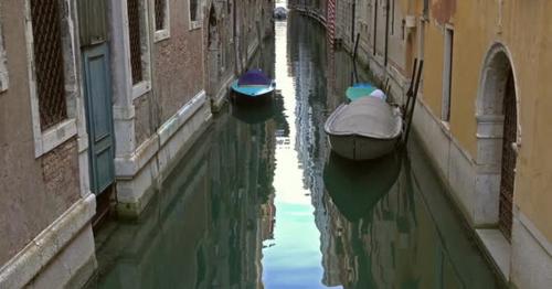 Old Houses and Narrow Canal in Venice, Italy,