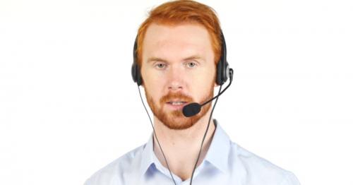 Talking with Customers, Call Center Operator with Red Hairs and Beard