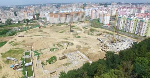 Builders are Working on the Construction of a High-Rise Building in the City