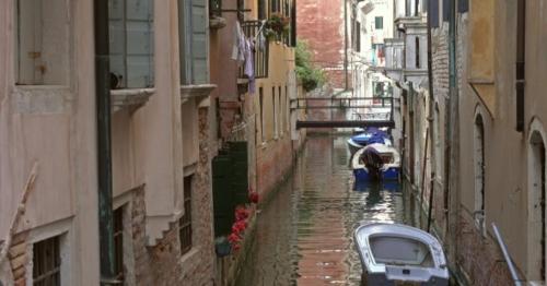 Old Houses and Narrow Canal in Venice, Italy