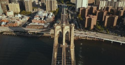 Aerial View of the Brooklyn Bridge Through the East River To Manhattan in New York