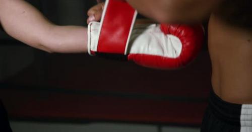 Coach Helps Women Boxer To Put On Gloves 17