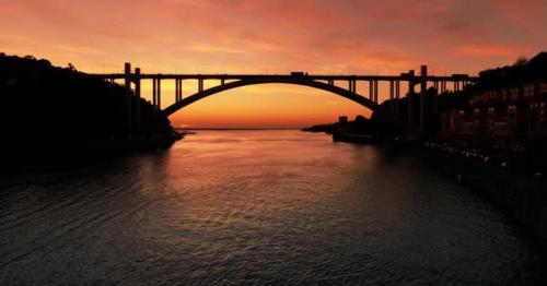 River and Bridge at Sunset