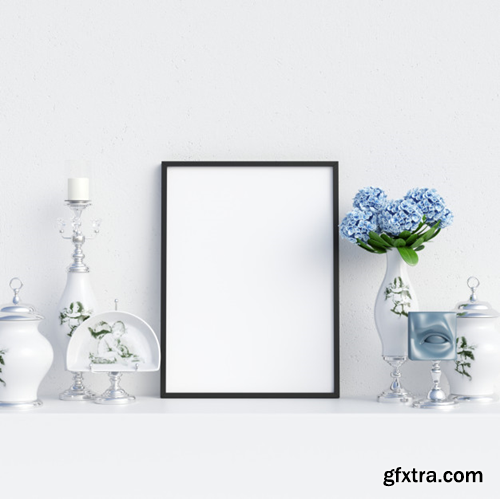 Frame mockup in white interior with decoration Premium Photo