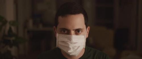 Videohive - Portrait of A Young Man Putting on A Protective Mask, Close Up - 26316007