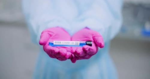 Videohive - Researcher Holding Covid-19 Sample Tube in Hand - 26283082