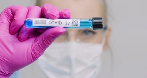 Videohive - Researcher Holding Covid-19 Sample Tube in Hand - 26283088