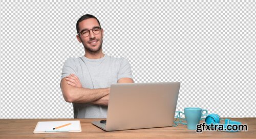 Satisfied young man sitting at his desk Premium Psd