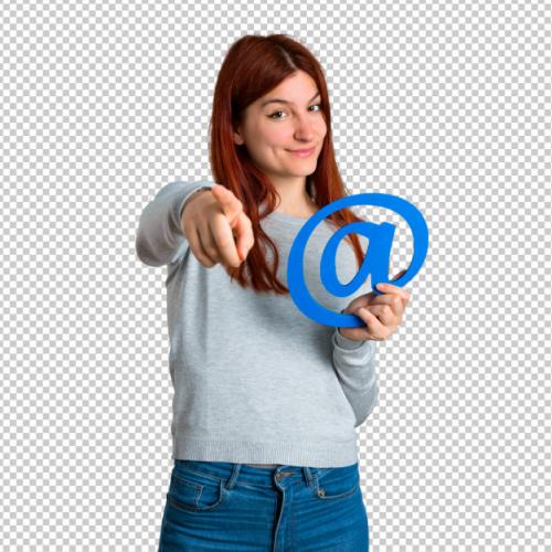 Young Redhead Girl Holding Icon Of At Dot Com Premium PSD