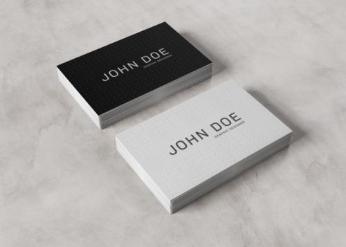 White Business Card Stack On Concrete Surface Premium PSD