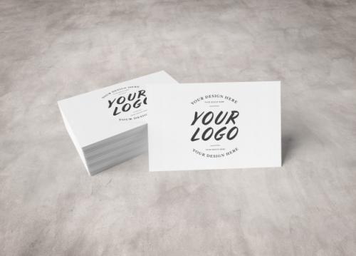 White Business Card Stack On Concrete Surface Premium PSD