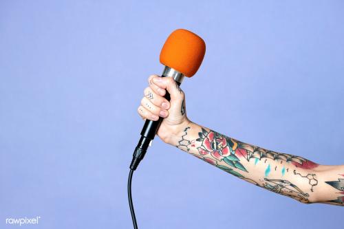 Hand with tattooed holding a microphone mockup - 2052606