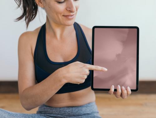 Yoga instructor showing a digital tablet mockup mobile phone wallpaper - 1225306