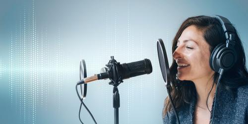 Female singer singing live in a studio - 1225684