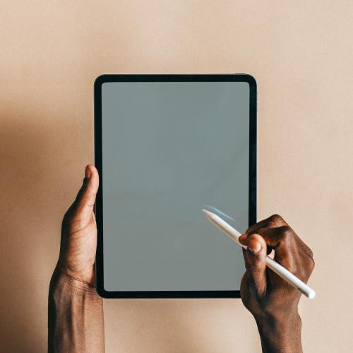 Black man using a digital tablet mockup - 1226328