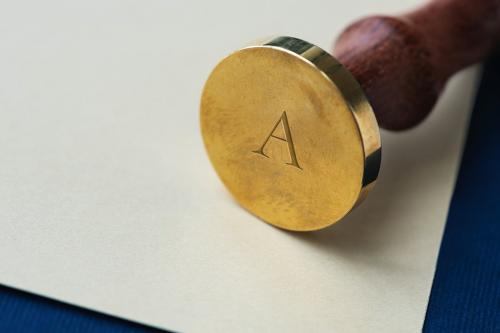 Vintage gold wax seal stamp with a wooden handle - 1212480