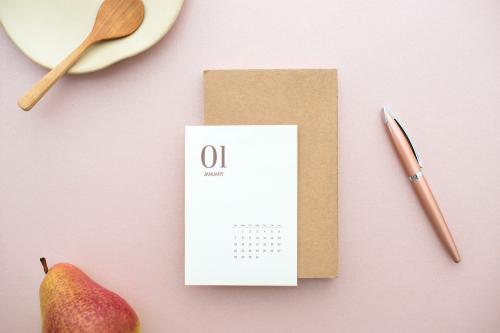 White card mockup on a pastel pink table - 1215162